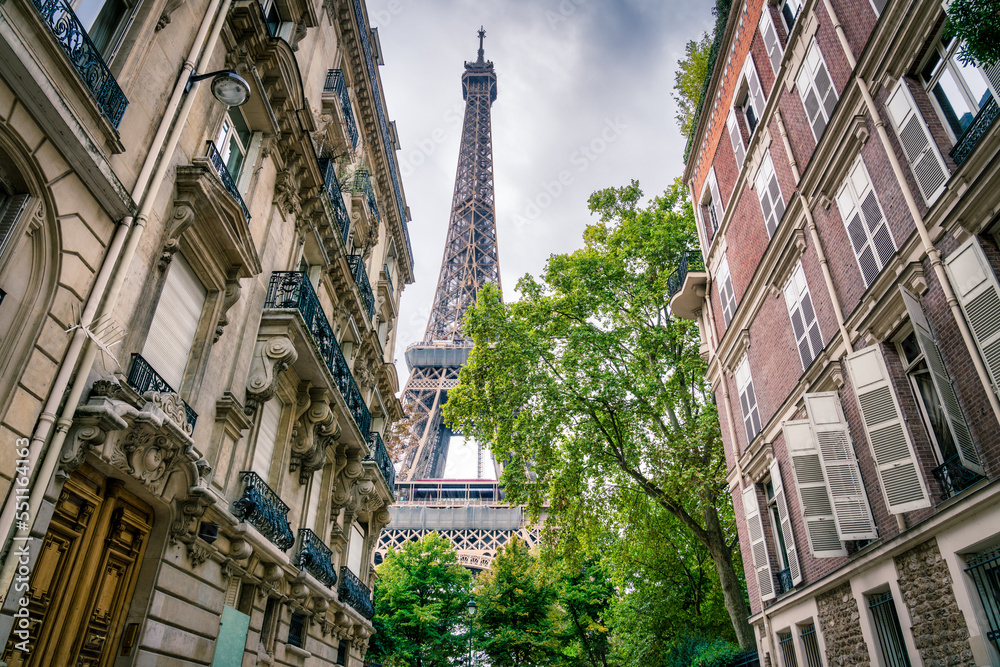 Eiffel Tower capture between buildings in Paris. France