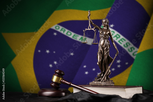 Brazil flag with statue of lady justice, constitution and judge hammer on black drapery. Concept of judgement and punishment
