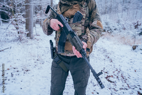 Tactical weapon of a soldier. Rifle, vest gun