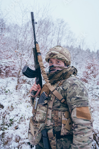 a member of the international legion in the middle of enemy territory. With assault rifle, ballistic vest and camouflage