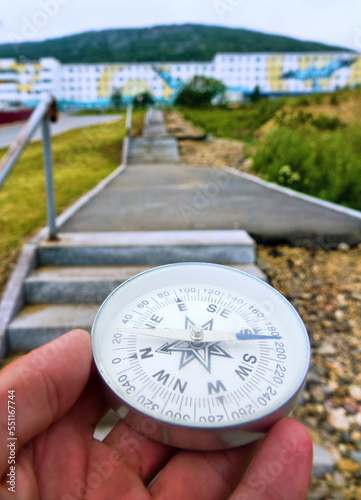 The right compass is always needed for travelers, adequate course. Small Towns tour. City Magadan photo