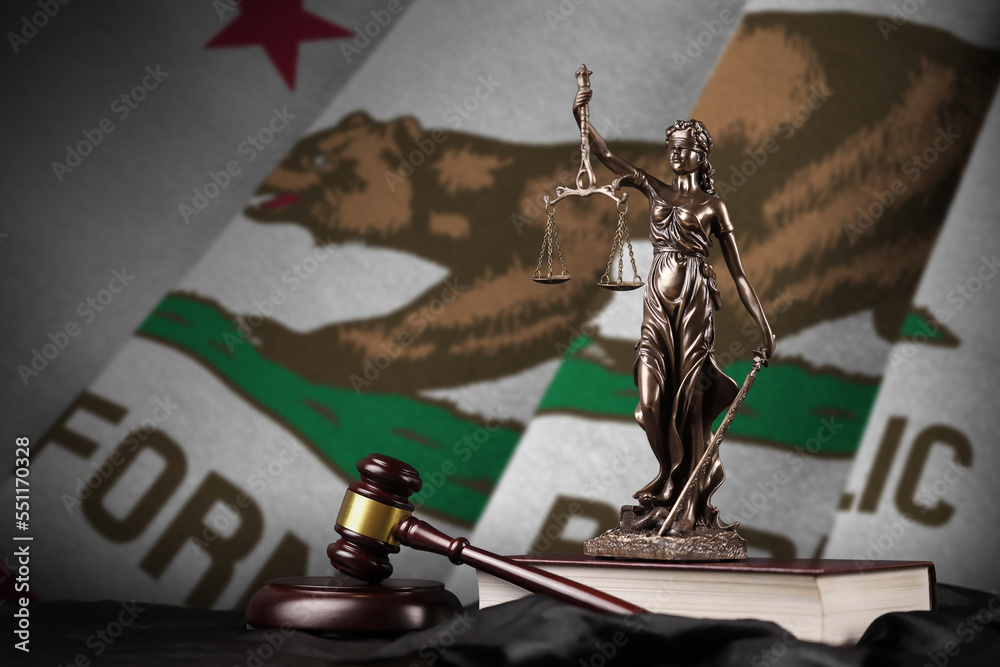 California US state flag with statue of lady justice, constitution and judge hammer on black drapery. Concept of judgement and punishment - obrazy, fototapety, plakaty 