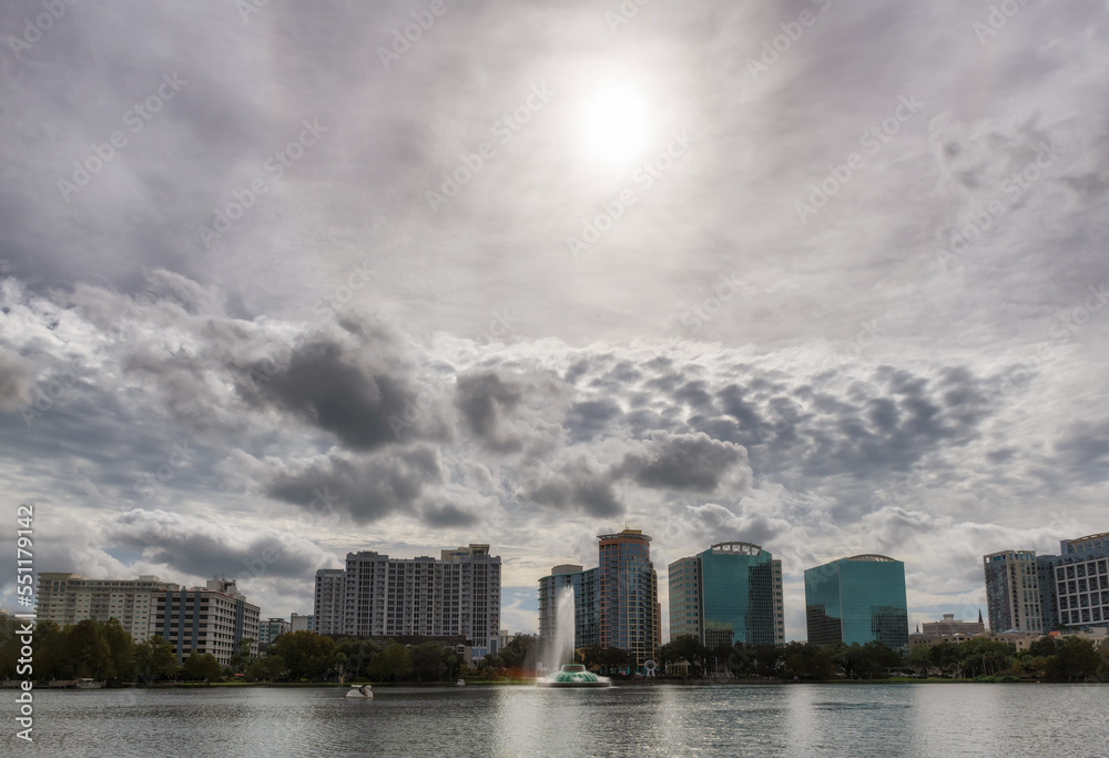 Sunny Orlando skyline and Lake Eola in the morning with city skyscrapers.