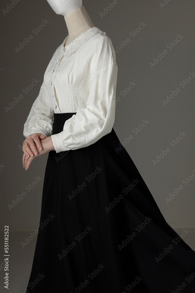A mannequin with human hands wearing a Victorian blouse and skirt A mannequin with human hands wearing a Victorian blouse and skirt