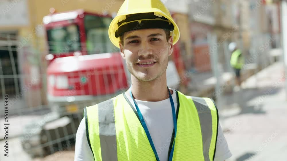 Young hispanic man architect smiling confident standing at park