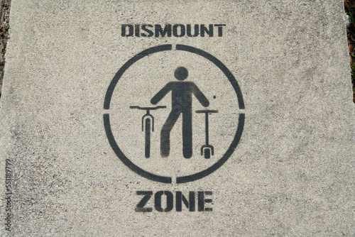 Dismount zone painted sign over the bridge at Miami, Florida