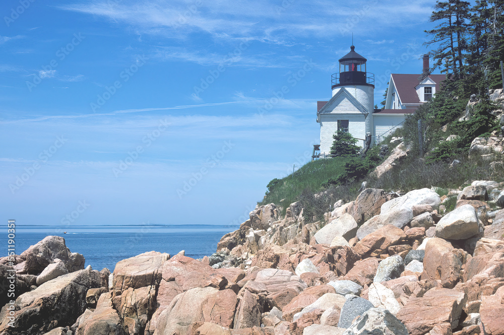 Scenic view of Bass Harbor Head Light and Lighthouse – a popular tourist destination in Acadia National Park. This coastal Maine landmark is listed in the National Register of Historic Places.