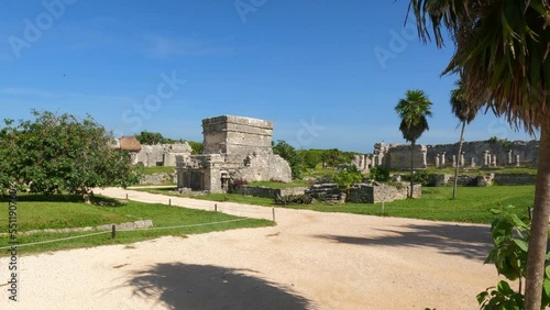 Walk through the mysterious ruins in the archaeological zone of Tulum, Mexico. The beautiful Caribbean coast with the purest water and the richest variety of animals and birds. Slow motion footage.