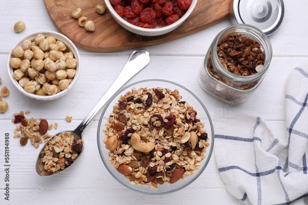 Flat lay composition with tasty granola on white wooden table Flat lay composition with tasty granola on white wooden table