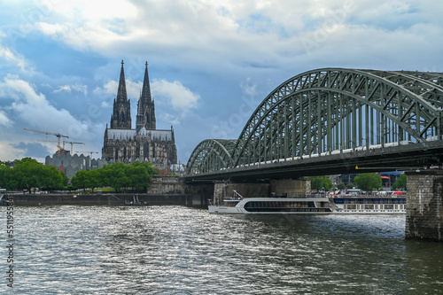 Cologne, Germany. Buildings in historic city centre. Towers of Cathedral. Famous Hohenzollern Bridge