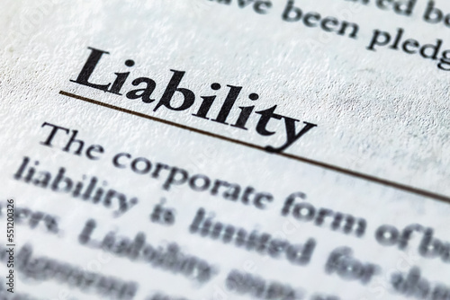 word liability printed in business legal law book or article photo