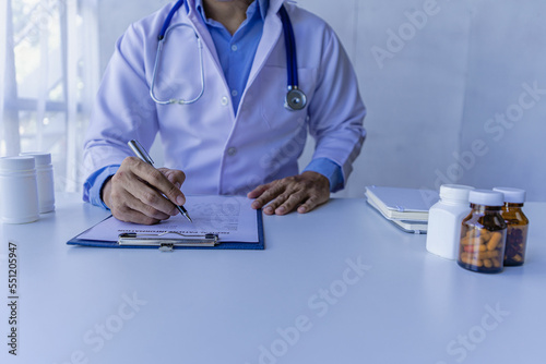 Psychiatrist consulting on women's gynecological diseases, writing prescription clipboard notes, listening to patients received in the clinic hospital.