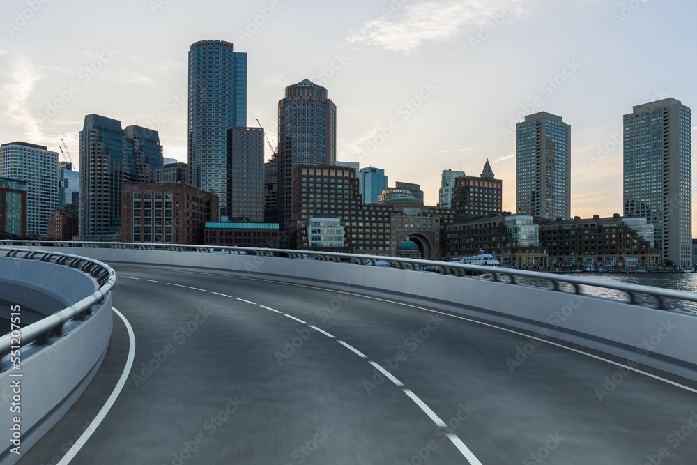 Empty urban asphalt road exterior with city buildings background. New modern highway concrete construction. Concept of way to success. Transportation logistic industry fast delivery. Boston. USA. Empty urban asphalt road exterior with city buildings background. New modern highway concrete construction. Concept of way to success. Transportation logistic industry fast delivery. Boston. USA.