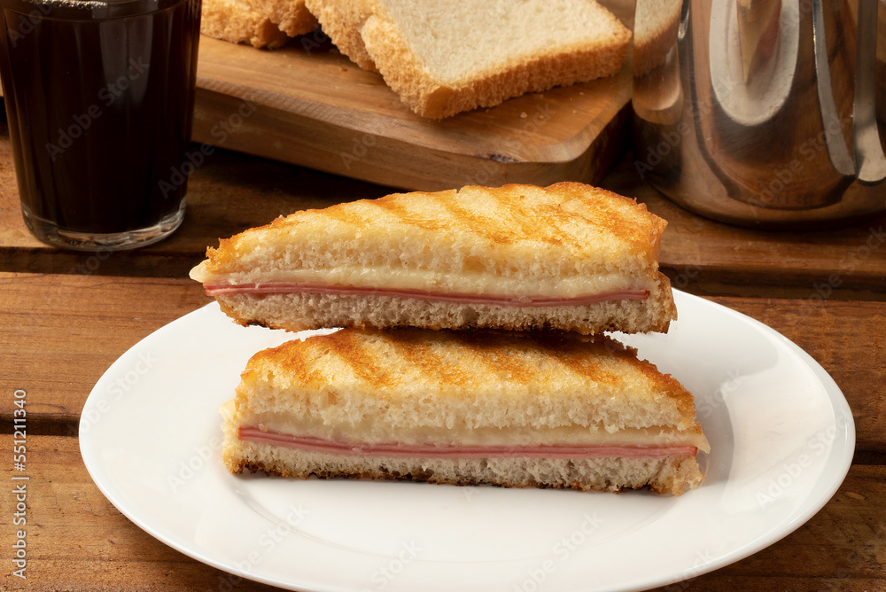 Sliced toasted bread with mortadella and cheese. Selective focus.