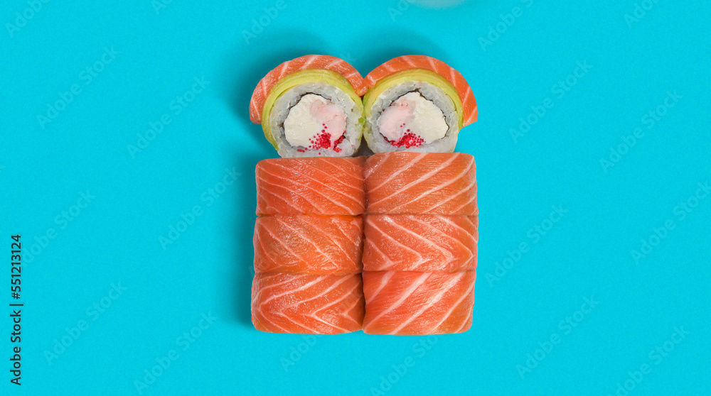 yummy and tasty sushi roll, close-up, from top view with many ingredients, high quality details, isolated on blue background, salmon, cheese, crab inside