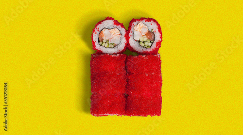 yummy and tasty sushi roll, close-up, from top view with many ingredients, high quality details, isolated on yellow background, red caviar, crab, tuna inside