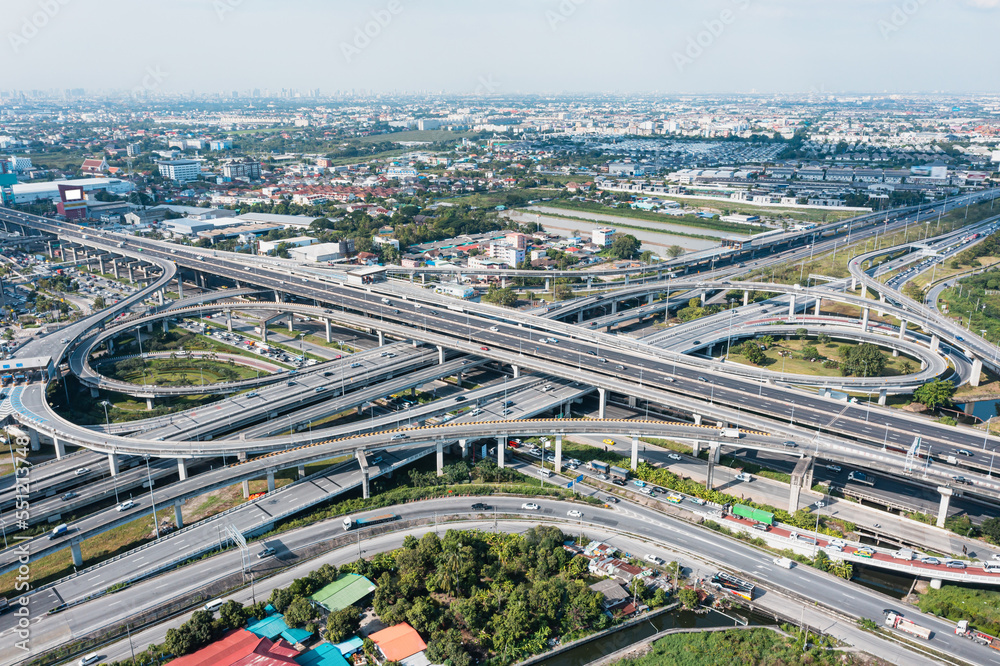 Multilevel junction motorway top view, Road traffic an important infrastructure in Thailand.Expressway Road and Roundabout.Transportation and travel concept.