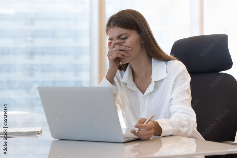 Tired frustrated office employee girl getting problems with laptop, software error, app wrong work, receiving bad news notification, feeling stressed, exhaustion, headache, covering face at workplace Tired frustrated office employee girl getting problems with laptop, software error, app wrong work, receiving bad news notification, feeling stressed, exhaustion, headache, covering face at workplace