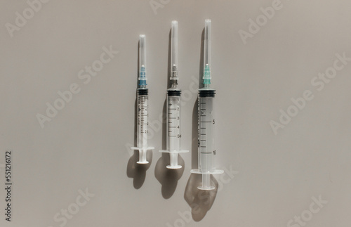 Syringes on a light background. Space for text. View from above. Flatlay.