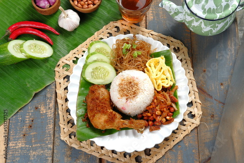 Nasi Uduk Betawi. Coconut flavored steamed rice dish from Betawi, Jakarta.served with several dishes.