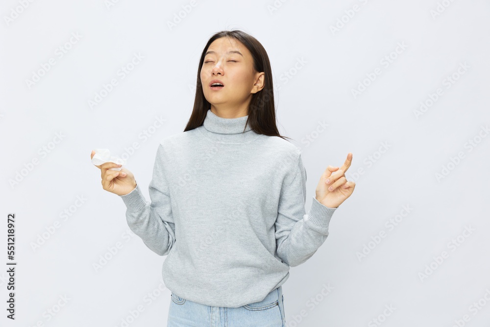Asian woman holding hand with handkerchief and coughing up flu and cold, stuffy nose viral disease asthma and allergies covid 19 white background Asian woman holding hand with handkerchief and coughing up flu and cold, stuffy nose viral disease asthma and allergies covid 19 white background