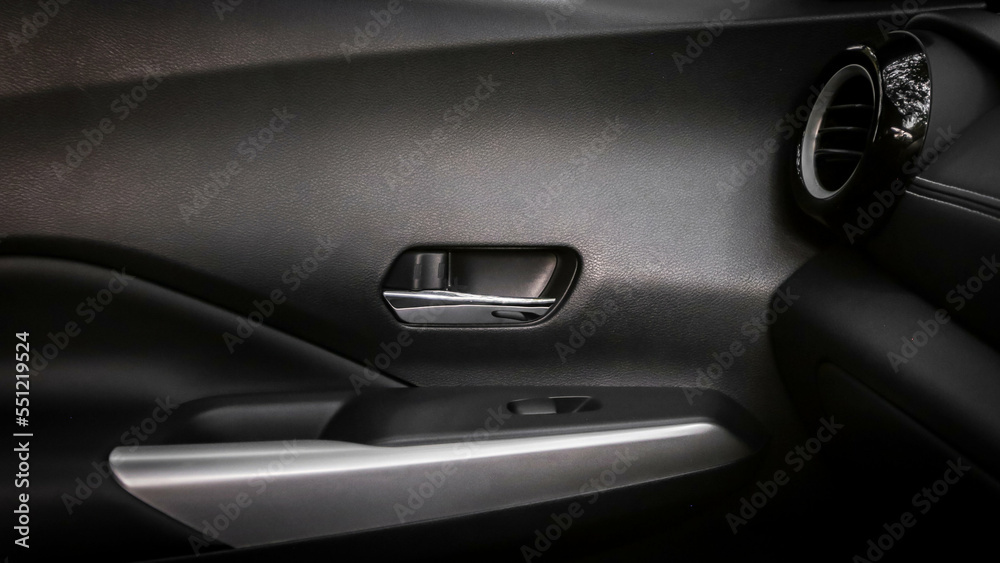 close-up of car start and stop buttons. Modern car interior with cockpit dashboard and steering wheel details close-up of car start and stop buttons. Modern car interior with cockpit dashboard and steering wheel details