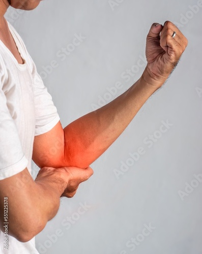 Photography Pain in the elbow joint of Southeast Asian young man