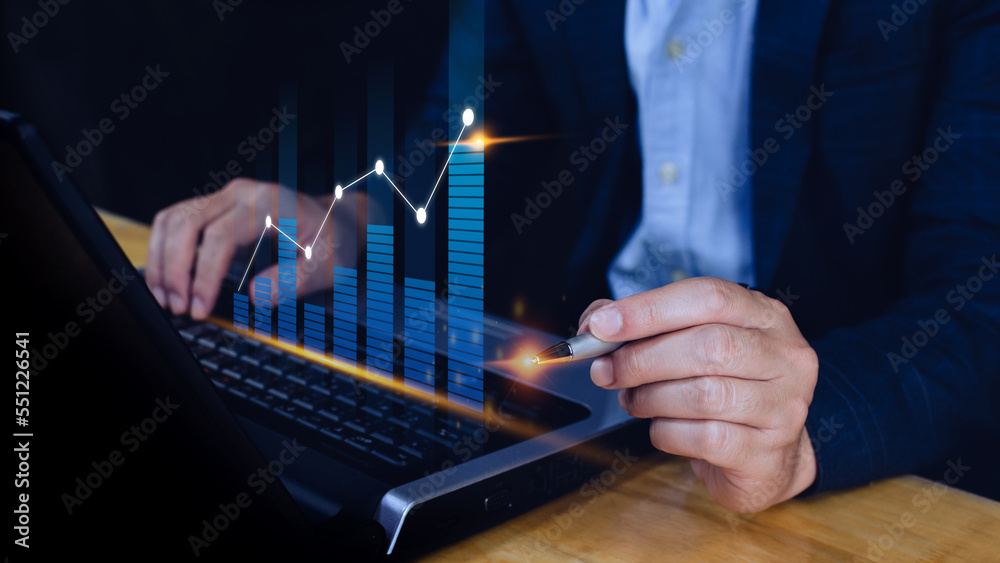 Fototapeta premium Businessman stylus pen touch points symbol stock graph and chart background, concept growth and development business investment, Stock market and strategy making market plan 