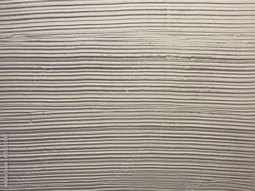 Horizontal stripes of gray cement concrete stains on the wall. Background, texture