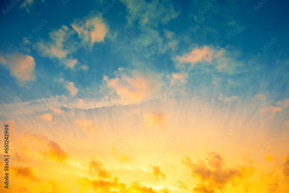 Fototapeta premium Colorful cloudy sky at sunset. Blue yellow gradient color.