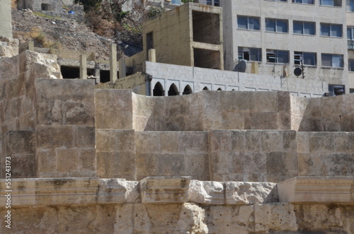 Ancient ruins of Greek and Roman buildings in the Citadel of Amman on a bright sunny day.
