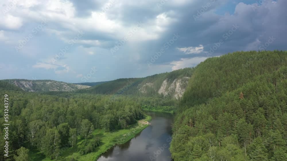 Aerial view of summer river and sunny rainbow. Green nature of Bashkortostan. River Agidel in summer. Drone view of summer river Aerial view of summer river and sunny rainbow. Green nature of Bashkortostan. River Agidel in summer. Drone view of summer river