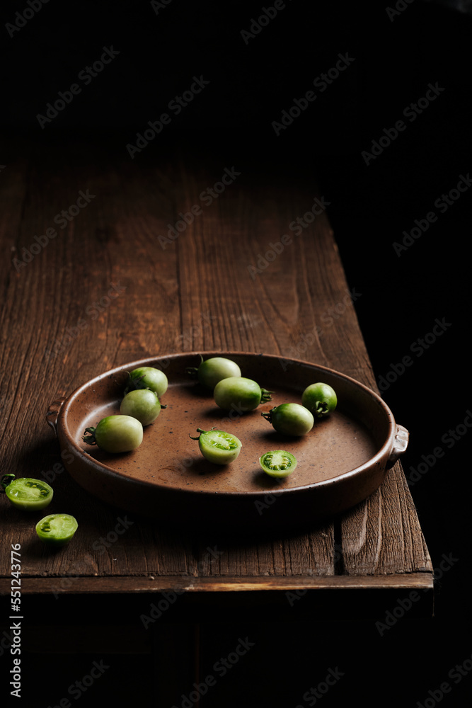 a colorful rustic plate put on a side wooden table a colorful rustic plate put on a side wooden table