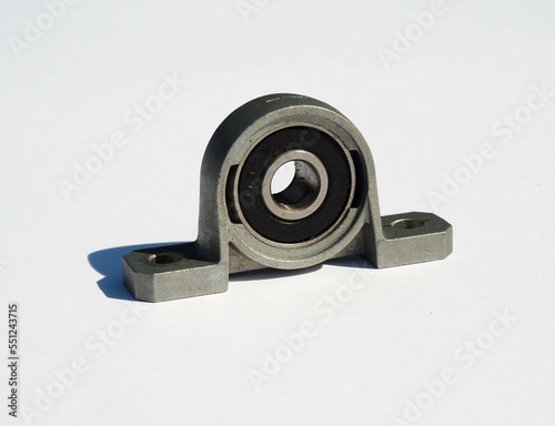 Metal ball bearing in housing. Two bolt flanged housing unit. Metal ball bearing pillow block photo