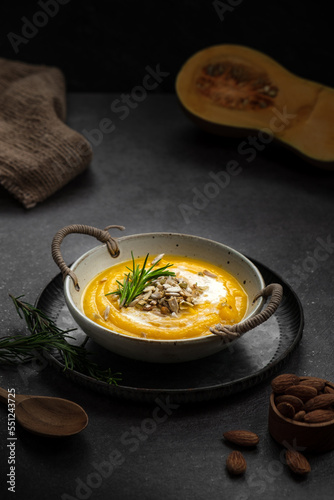 a pumpkin soup on dark background