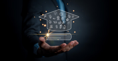 Graduate education certificate concept. man hands showing graduation hat, Internet online education course degree, study knowledge to creative thinking idea and problem solving solution