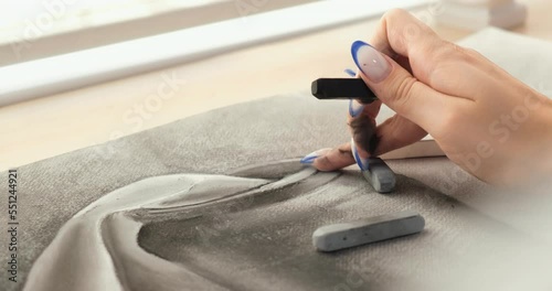Young artist paints with pastel crayons. A pastel painting. The concept of creativity, art, online learning of painting and drawing