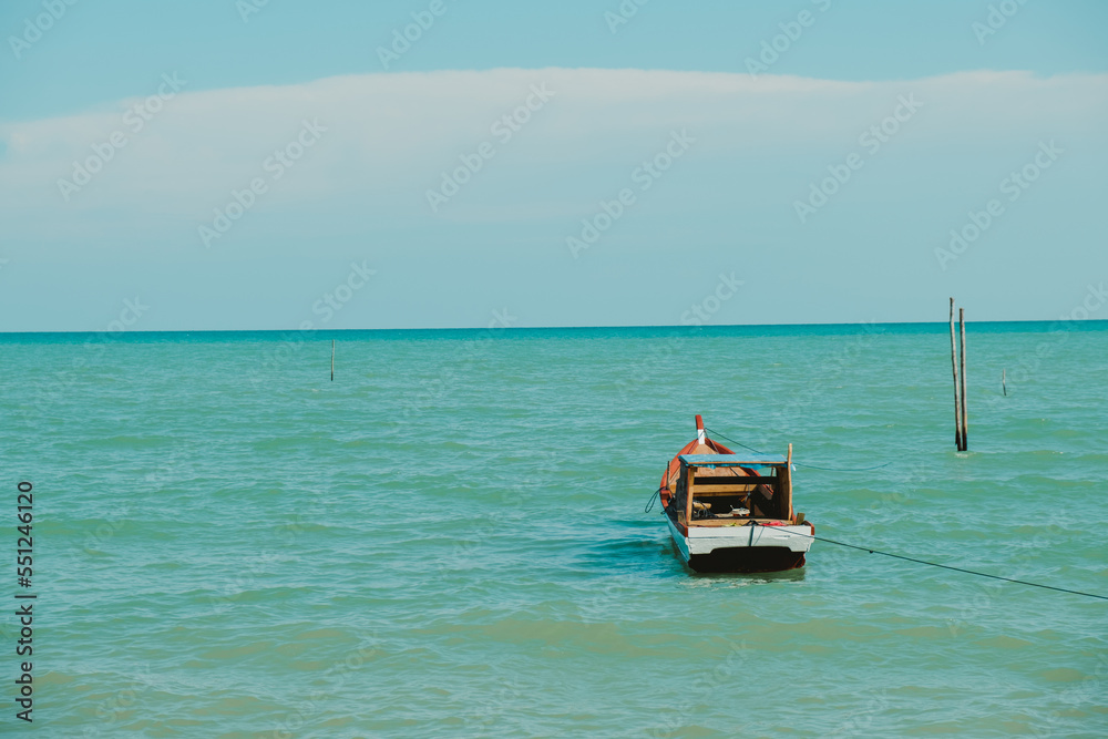 a fishing boat bobbing in the sea