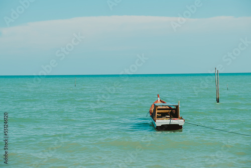 a fishing boat bobbing in the sea