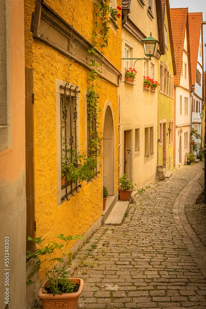Alley in Rothenburg ob der Tauber, picturesque medieval city in Germany, famous UNESCO world culture heritage site, popular travel destination.