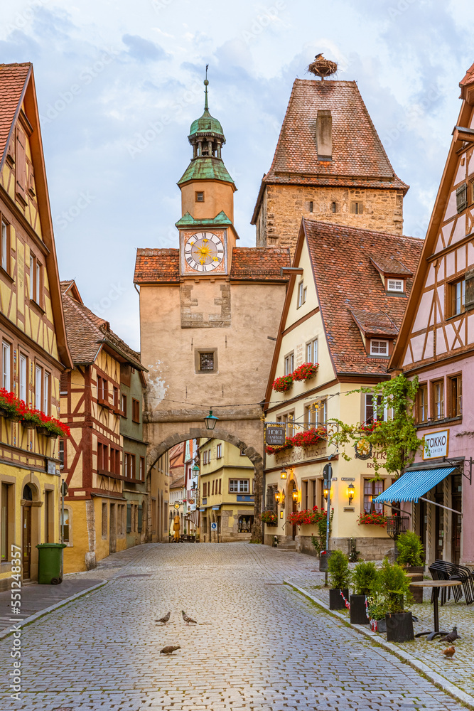 Rothenburg ob der tauber / Germany - July 27 2019: Picturesque medieval city in Germany, famous UNESCO world culture heritage site, popular travel destination in beautiful light.