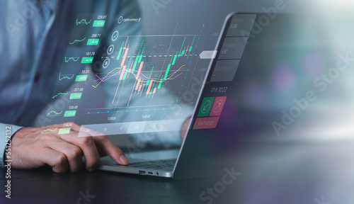 Businessman working with using computer of financial and analyzing sales data , Finance analyst using laptop analyzing stock market data, Stock market analysis, global economy, finance and investment.