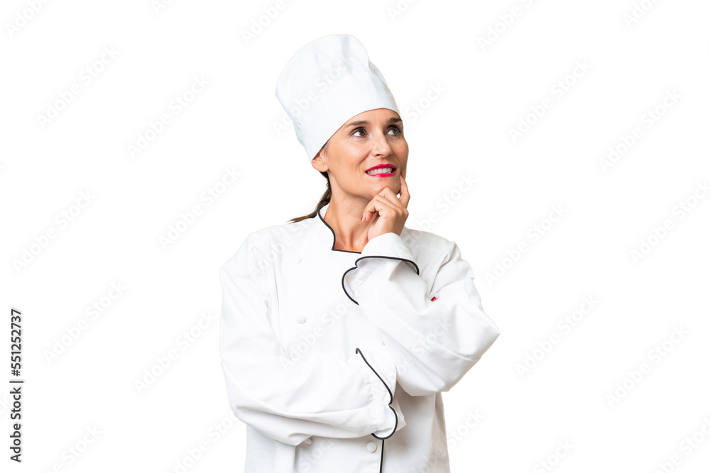 Middle-aged chef woman over isolated background thinking an idea while looking up Middle-aged chef woman over isolated background thinking an idea while looking up
