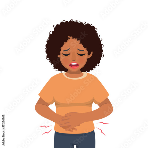 Young African woman suffering from stomachache, diarrhea, indigestion problem, abdominal pain, food poisoning, nausea, gastritis or bloating