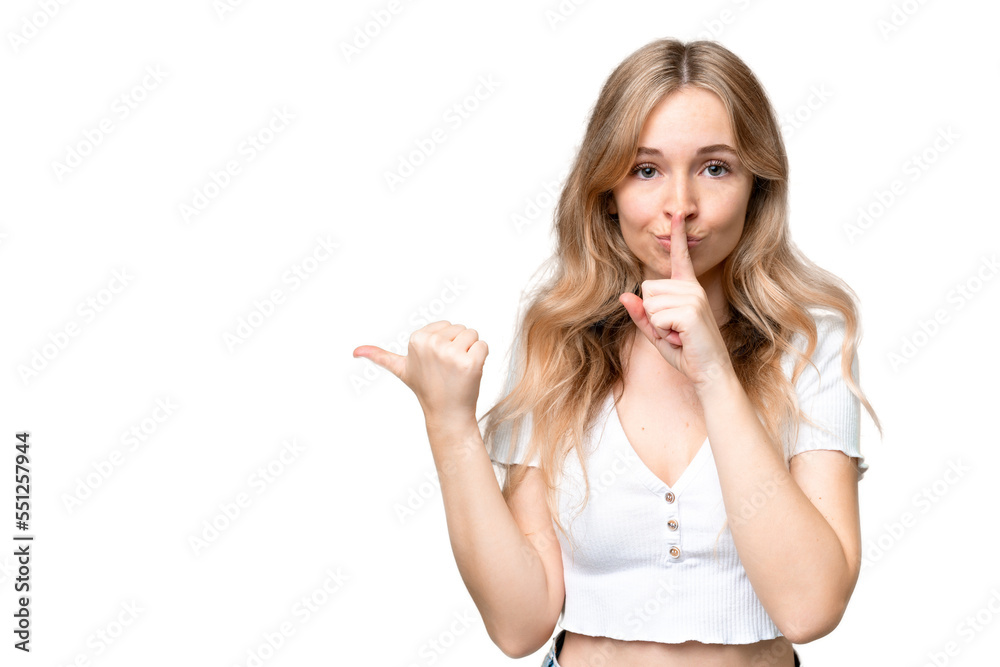 Young English woman over isolated background pointing to the side and doing silence gesture Young English woman over isolated background pointing to the side and doing silence gesture