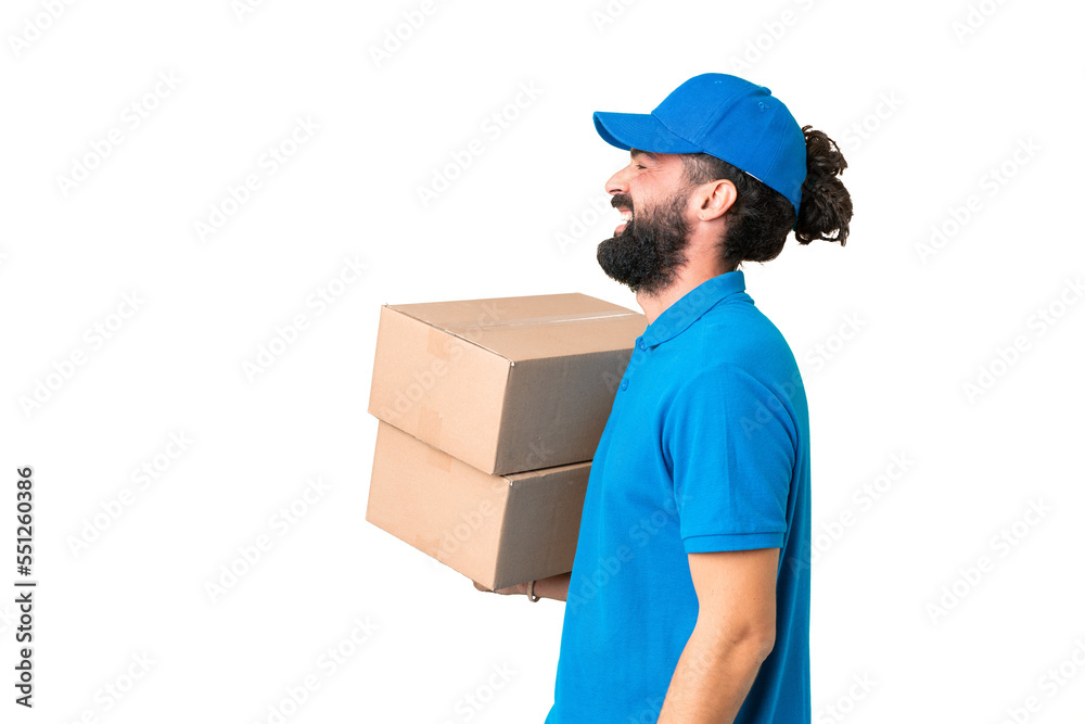 Delivery caucasian man over isolated chroma key background laughing in lateral position Delivery caucasian man over isolated chroma key background laughing in lateral position
