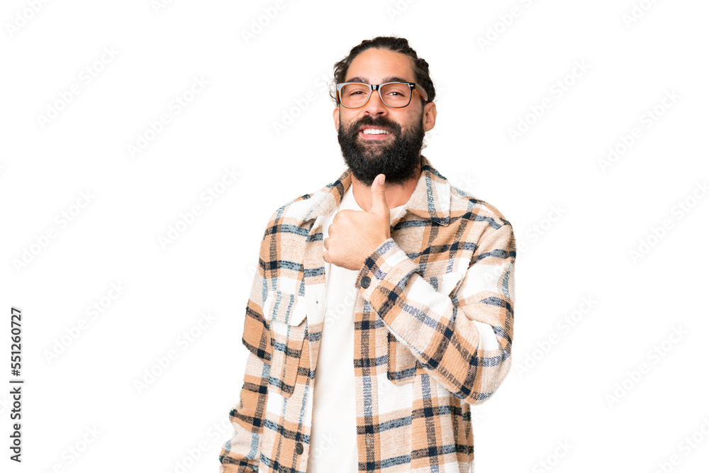 Young man with beard over isolated chroma key background giving a thumbs up gesture Young man with beard over isolated chroma key background giving a thumbs up gesture