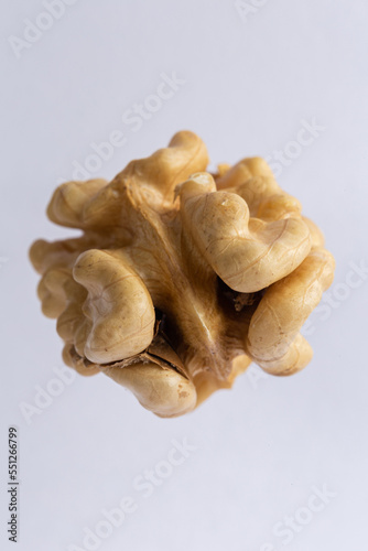 dry peeled walnut on white background