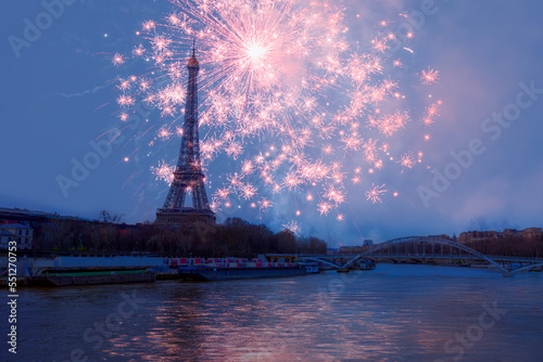 Eiffel tower with fireworks at night in Paris, France. The Eiffel tower is the most visited touristic attraction in France