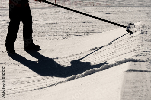 Shaper in snowpark Madonna di Campiglio Trentino and ursus snowpark in Val Rendena dolomites Italy in winter
